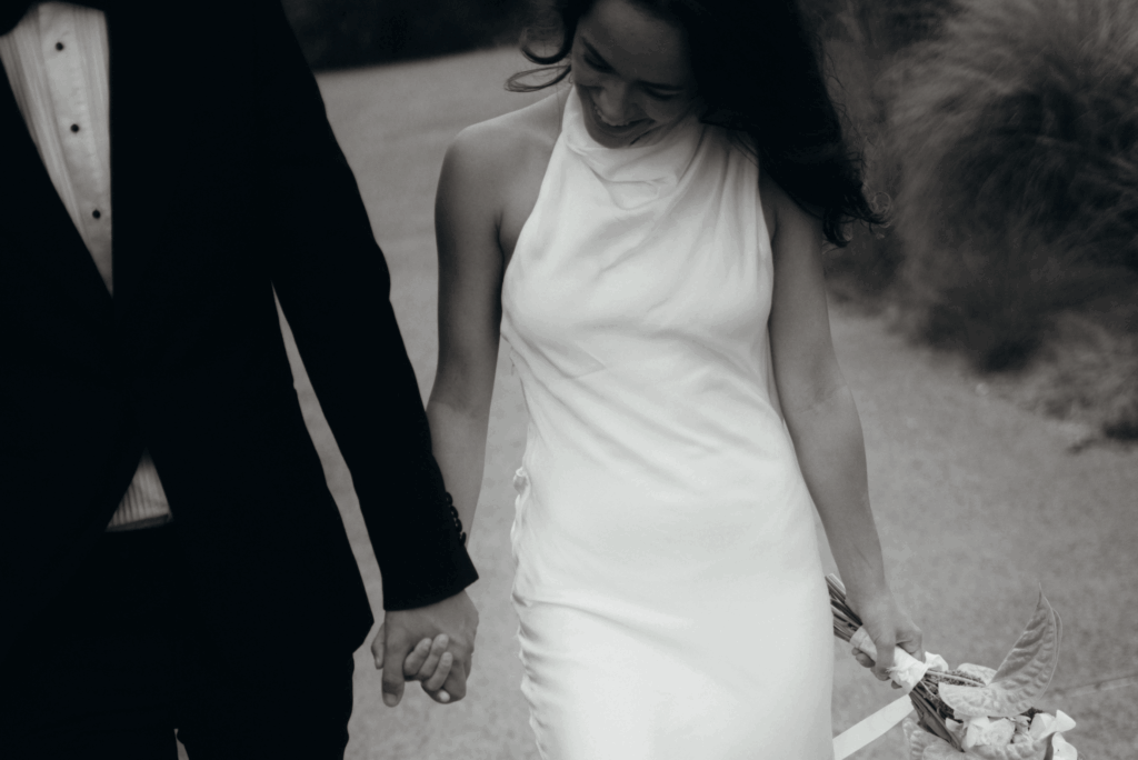 romantic photoshoot as glamorous couple walk down the street in Gippsland Australia