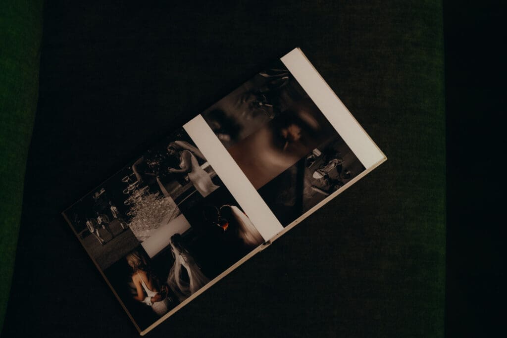 Fine Art Wedding Album, displaying beautiful key moments from your wedding day. Open on a green velvet couch.