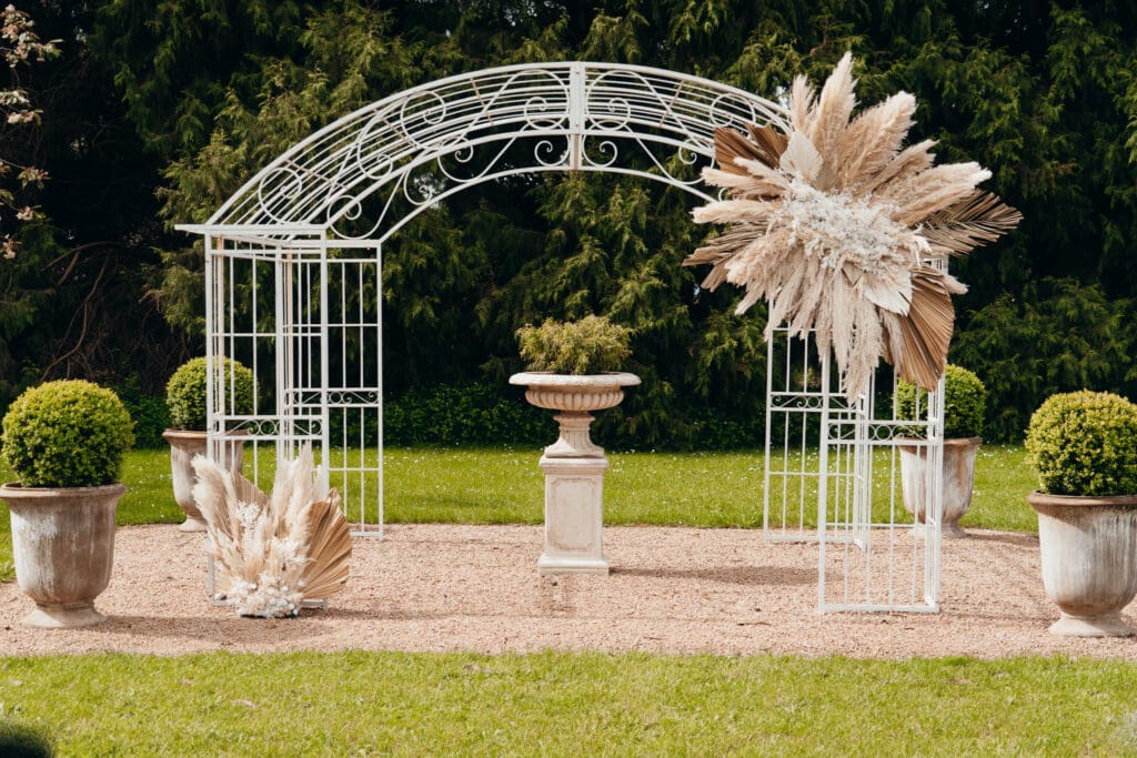 Elegant Wedding Arbour with Dried floral arrangement at Glenfyne Weddings in Gippsland, photo by Ebb and Flow Photography