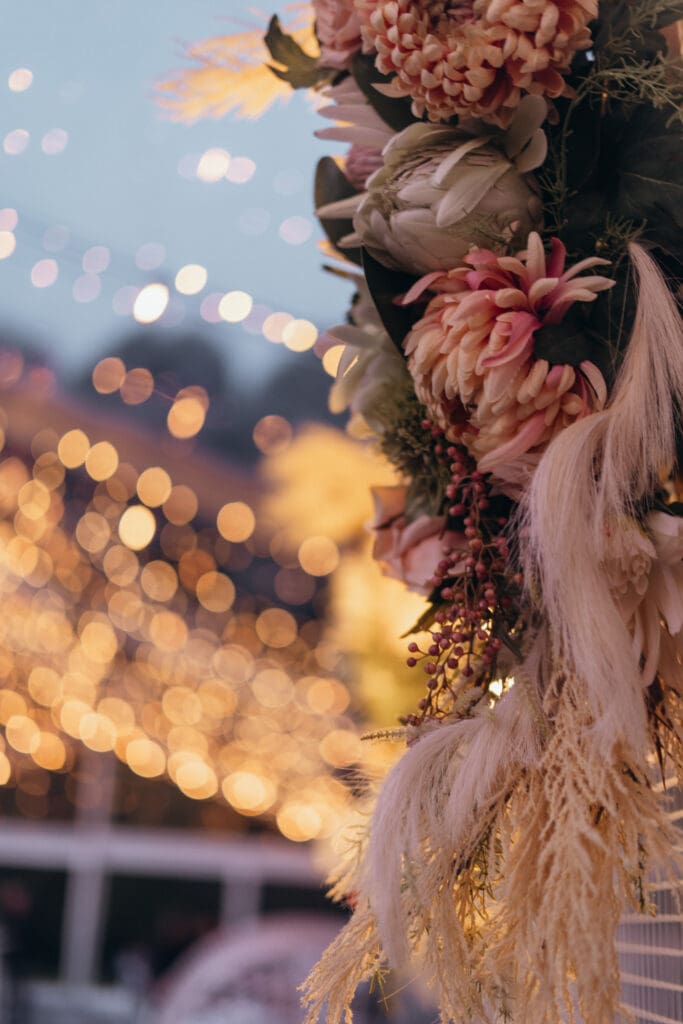 Stunning dried florals in the clear marquee at twilight, fairy lights wedding, at Glenfyne Weddings in Gippsland, photo by Ebb and Flow Photography